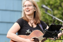 Musician Kirsten Hazler with her guitar